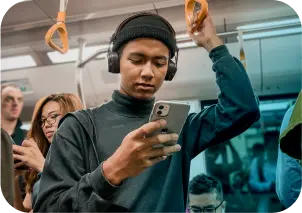 Someone listening to an audiobook in the subway.