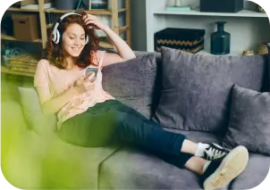 Someone listening to a classic audiobook in a couch.